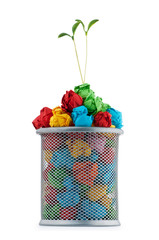 Paper recycling concept with seedlings on white