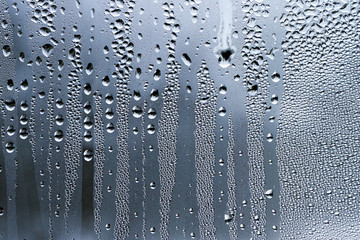 Water droplets on a glass surface - obrazy, fototapety, plakaty