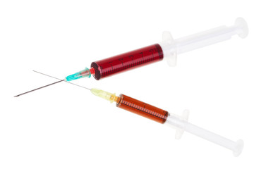 Fototapeta premium Two syringes with red liquid isolated over white background.