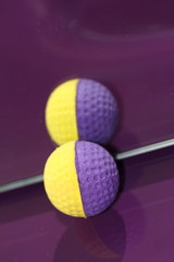 A terry ball in the mirror on a lilac surface