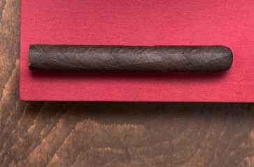 Cigar on a red background.