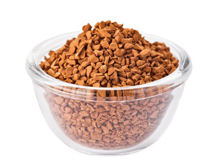 Instant granulated coffee heap in transparent glass bowl, isolat