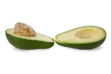 two halves of avocado fruit isolated on white.
