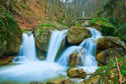 waterfall on a spring mountain river © Yuriy Kulik