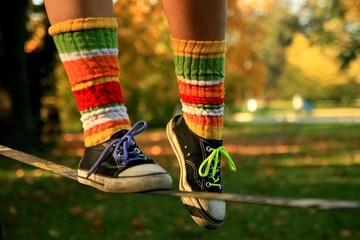 Walking the slackline in sneakers and colour socks