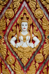 Fototapeta premium divinity on tample wall,thailand