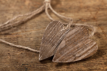 tied wooned hearts on old  wood © Elena Moiseeva