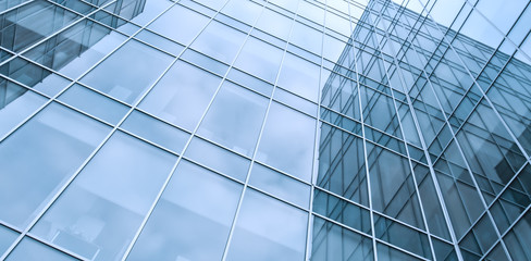 blue texture of glass transparent skyscrapers at night