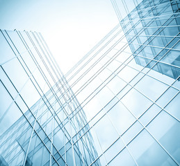 low angle view to light glass buildings of business center