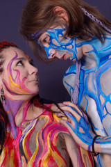 Boy and girl with body painting.