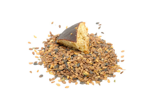 Sesame Seeds And Piece of Cookie Isolated on White Background