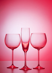 Wine glasses against gradient background