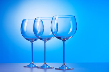 Wine glasses against gradient background