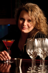 A beautiful woman at the cocktail bar
