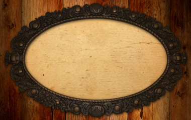 antique frame with blank paper on knotty wood wall