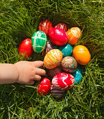 Hand taking Easter egg