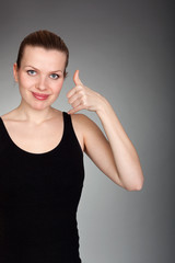 beautiful woman making a call me gesture