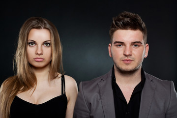 young couple standing next to each other