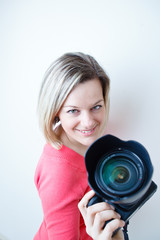 Fototapeta premium pretty female photographer with her digital camera