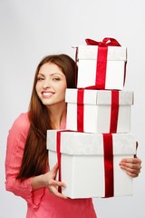 Beautiful brunette woman with a gift boxes