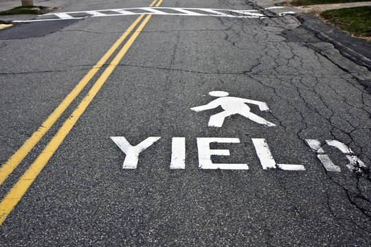 Pedestrian yield sign on a road