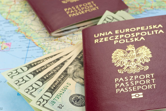 Passports and money over map background