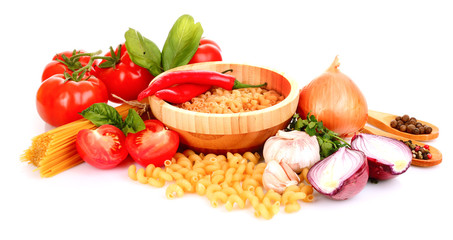 Pasta spaghetti with tomatoes, olive oil and basil on a white ba