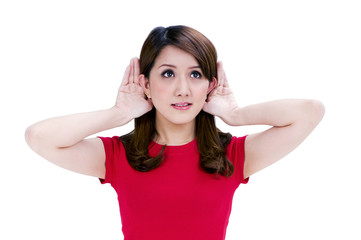 Fototapeta premium Attractive young woman with hands behind her ears