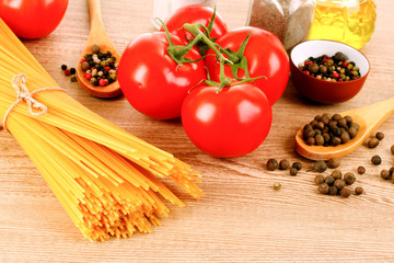 Pasta spaghetti with tomatoes, olive oil, peper  and basil on a