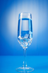 Water in the glass against gradient background