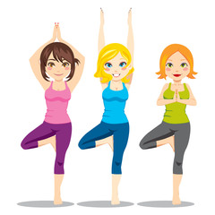 Three women exercising yoga tree posture