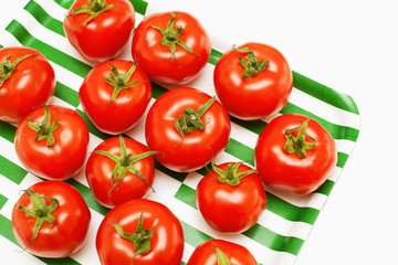 tomatoes on striped tray