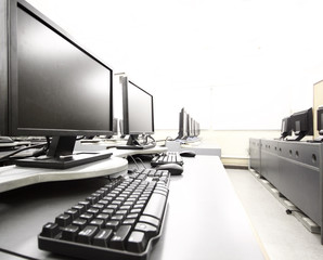workplace room with computers in row