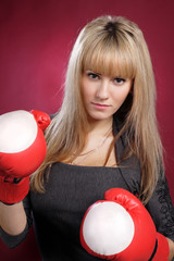 sexy beautiful blond woman in boxing gloves