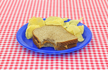 Bitten Peanut Butter Sandwich With Chips