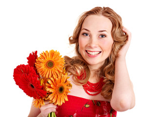 Happy young woman holding flowers.