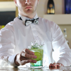 pro barman prepare coctail drink on party