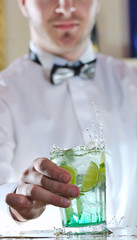 pro barman prepare coctail drink on party