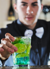 pro barman prepare coctail drink on party