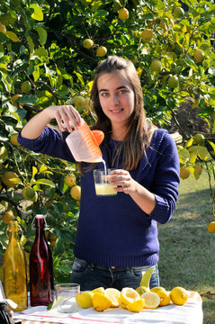 Girl making natural lemonade