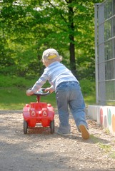 Boy with his toy car