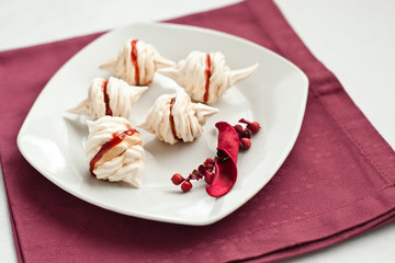 Meringues filled with strawberry jam