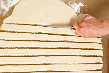 Hands of a woman preparing cookies