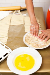 Hands of a woman preparing cookies