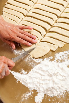 Hands of a woman preparing cookies