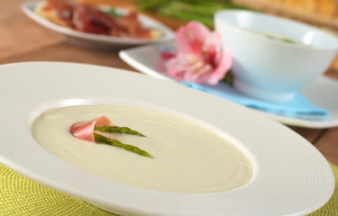 Cream of asparagus garnished with green asparagus