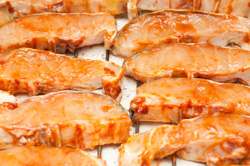 sturgeon filets marinated in tomato sauce