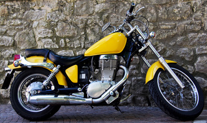 Obraz na płótnie Canvas zwyczaj żółty motocykl