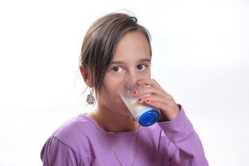 Portrait of a  girl drinking a glass of milk