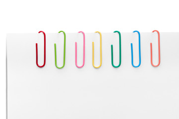 Obraz premium Different colored paperclips
